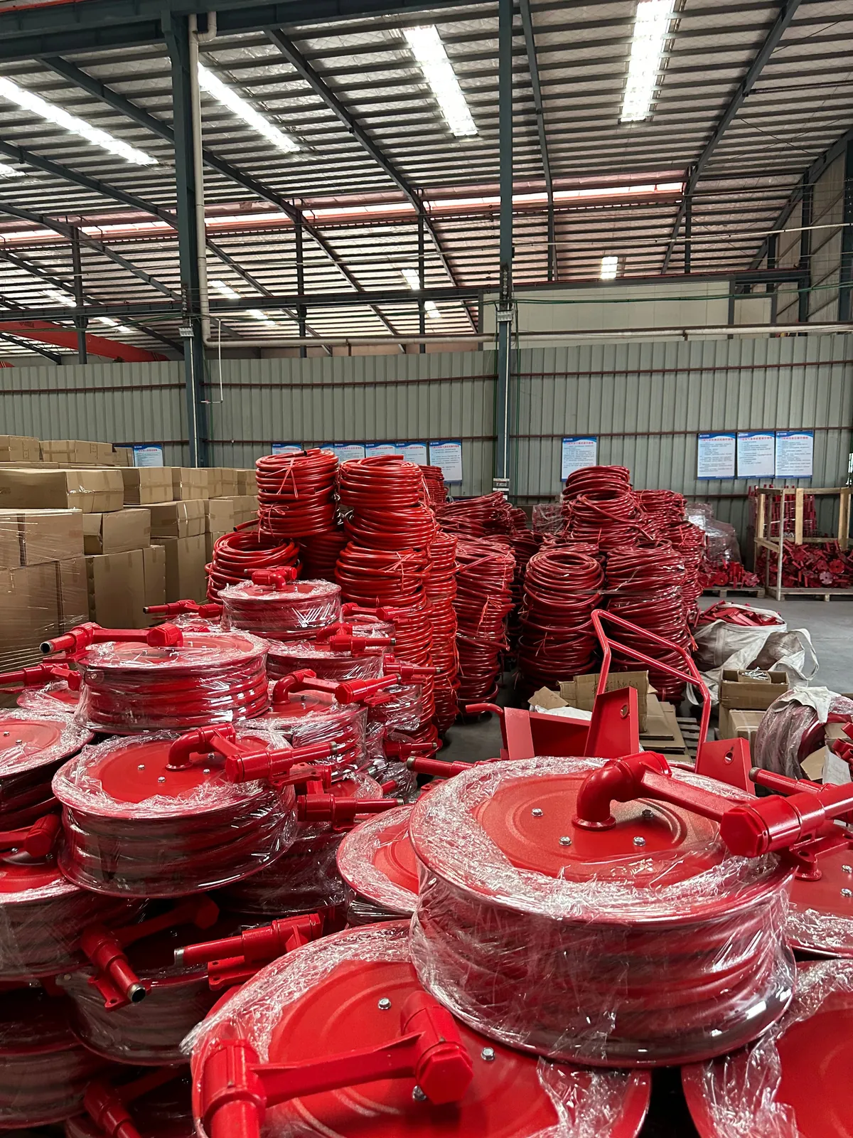 Finished fire hose reels and coiled fire hose staged for export at Wanlian Fluid