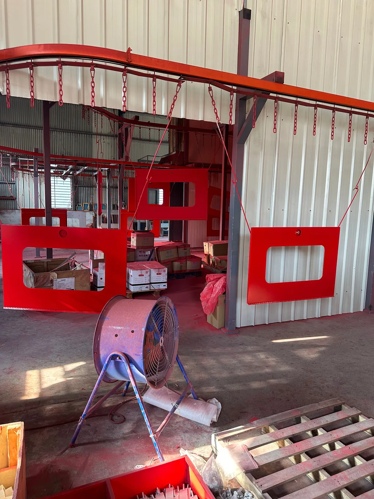 Overhead powder-coating conveyor line at Wanlian Fluid